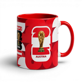 Fann Bliss ceramic coffee mug featuring a red and white Austria FIFA World Cup design with the trophy graphic.