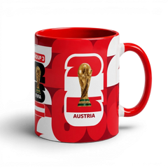 Fann Bliss ceramic coffee mug featuring a red and white Austria FIFA World Cup design with the trophy graphic.