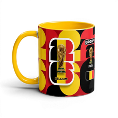 Fann Bliss Belgium World Cup ceramic coffee mug with red, black, and yellow pattern and FIFA trophy graphic.