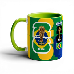 Fann Bliss Fifa World Cup Brazil commemorative ceramic mug with trophy and flag design. Green interior and handle.