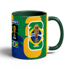 Fann Bliss FIFA World Cup Brazil commemorative ceramic mug with trophy and flag design. Green, yellow, blue.