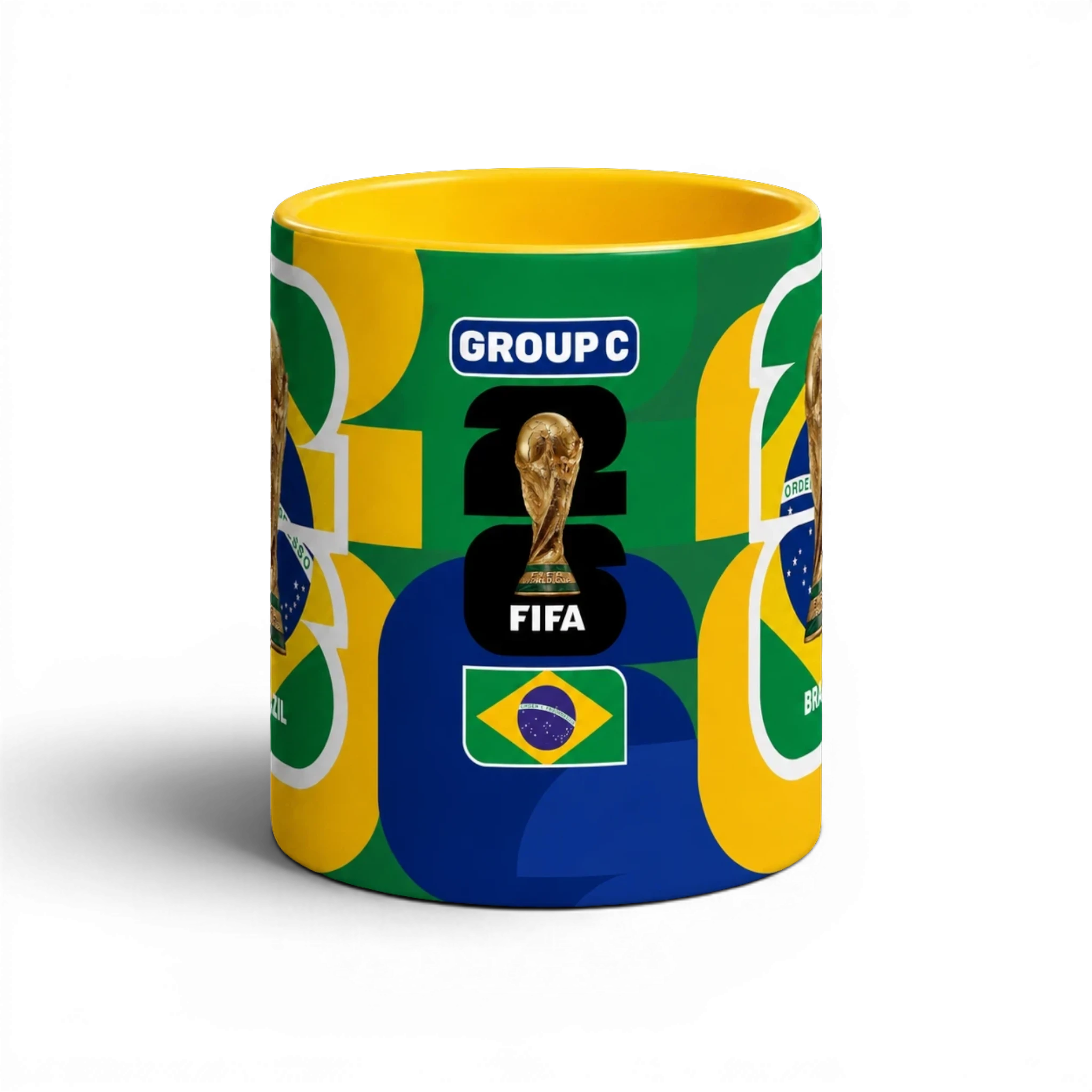 Fann Bliss FIFA World Cup Brazil commemorative coffee mug with trophy and flag design. Ceramic, yellow interior.