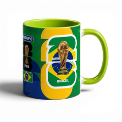 Fann Bliss Fifa World Cup Brazil commemorative ceramic mug with trophy and flag design. Green interior and handle.