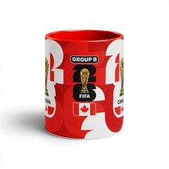 Fann Bliss red and white ceramic coffee mug featuring Canada soccer graphics and the FIFA World Cup trophy.