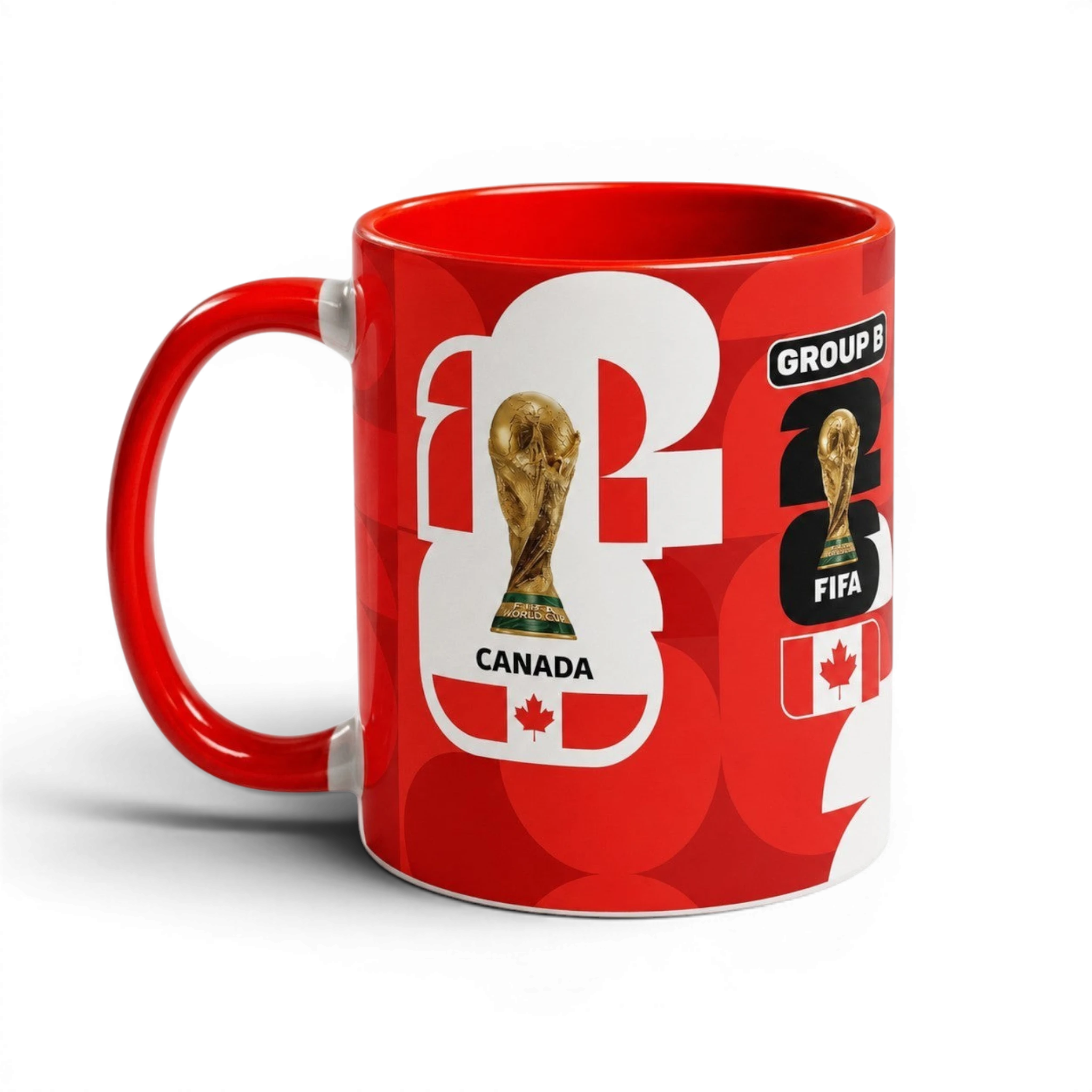 Fann Bliss red ceramic coffee mug featuring FIFA World Cup trophy, Canadian flag, and Group B soccer graphics.