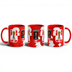 Fann Bliss red and white ceramic Canada Soccer World Cup commemorative mug with trophy and Group B graphics.