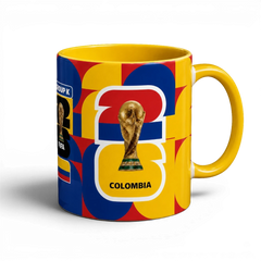 Fann Bliss ceramic mug with Colombia flag colors, FIFA World Cup trophy graphic, and geometric pattern.