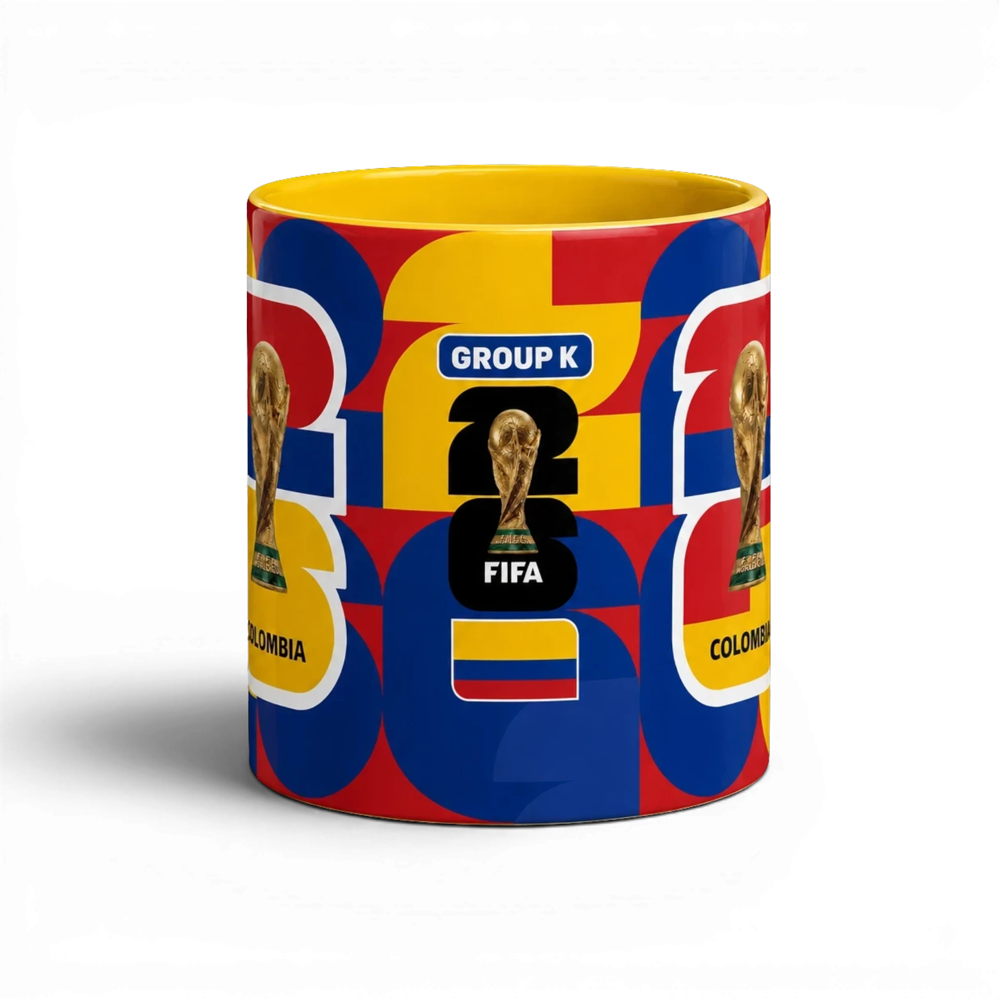 Fann Bliss ceramic mug with Colombia flag colors, FIFA World Cup trophy graphic, and geometric pattern.