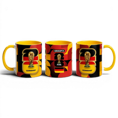 Fann Bliss Germany FIFA World Cup commemorative mug with trophy and flag colors. Ceramic, yellow handle.
