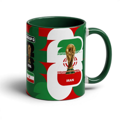 Fann Bliss ceramic coffee mug featuring the Iran flag and FIFA World Cup trophy in green, white, and red colors.