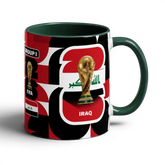 Fann Bliss ceramic coffee mug featuring the Iraq flag, FIFA World Cup trophy, and Group I branding on a dark background
