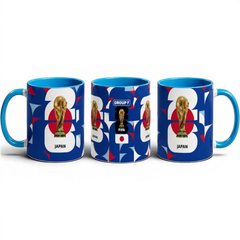 Fann Bliss ceramic coffee mug featuring Japan World Cup trophy, geometric blue, white, and red patterns.