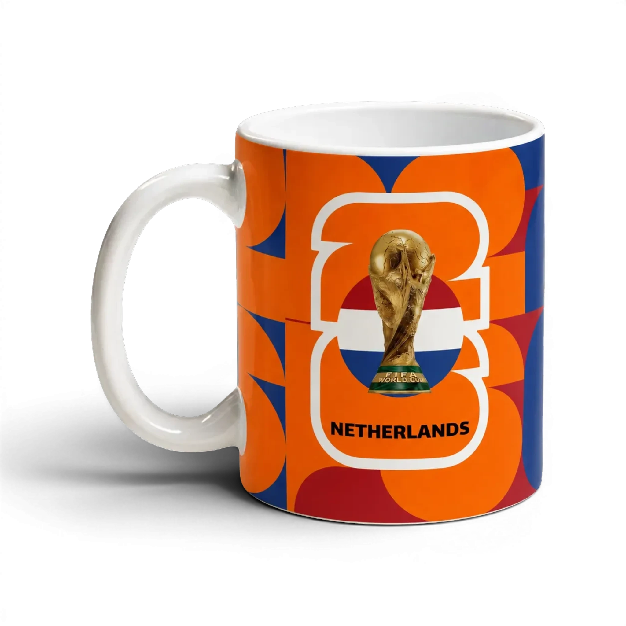 Fann Bliss Netherlands FIFA World Cup commemorative ceramic mug with orange, white, and blue geometric pattern.