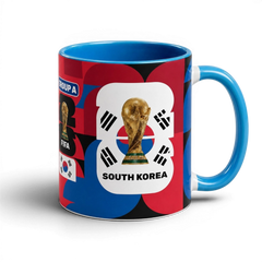 Fann Bliss South Korea World Cup ceramic mug with trophy graphic, blue interior, and red, blue, and black patterns.