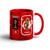 Fann Bliss Tunisia FIFA World Cup 2026 commemorative mug. Red ceramic with trophy, flag, and team details.