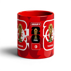 Fann Bliss Tunisia FIFA World Cup 2026 commemorative mug. Red ceramic with trophy, flag, and "Tunisia" text.