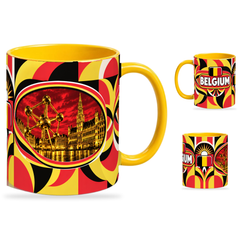 Belgium Mug – 320ml with yellow handle, showing the landmark side plus companion country-name and centered-flag views of the glossy full-wrap design by Fann Bliss.