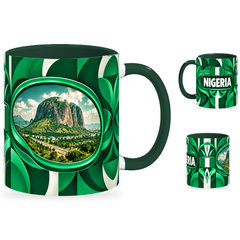 Nigeria Mug – 320ml with dark green handle, showing the landmark side plus companion country-name and centered-flag views of the glossy full-wrap design by Fann Bliss.