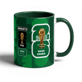 Fann Bliss Saudi Arabia FIFA World Cup 2026 commemorative mug in green with trophy and national emblem.