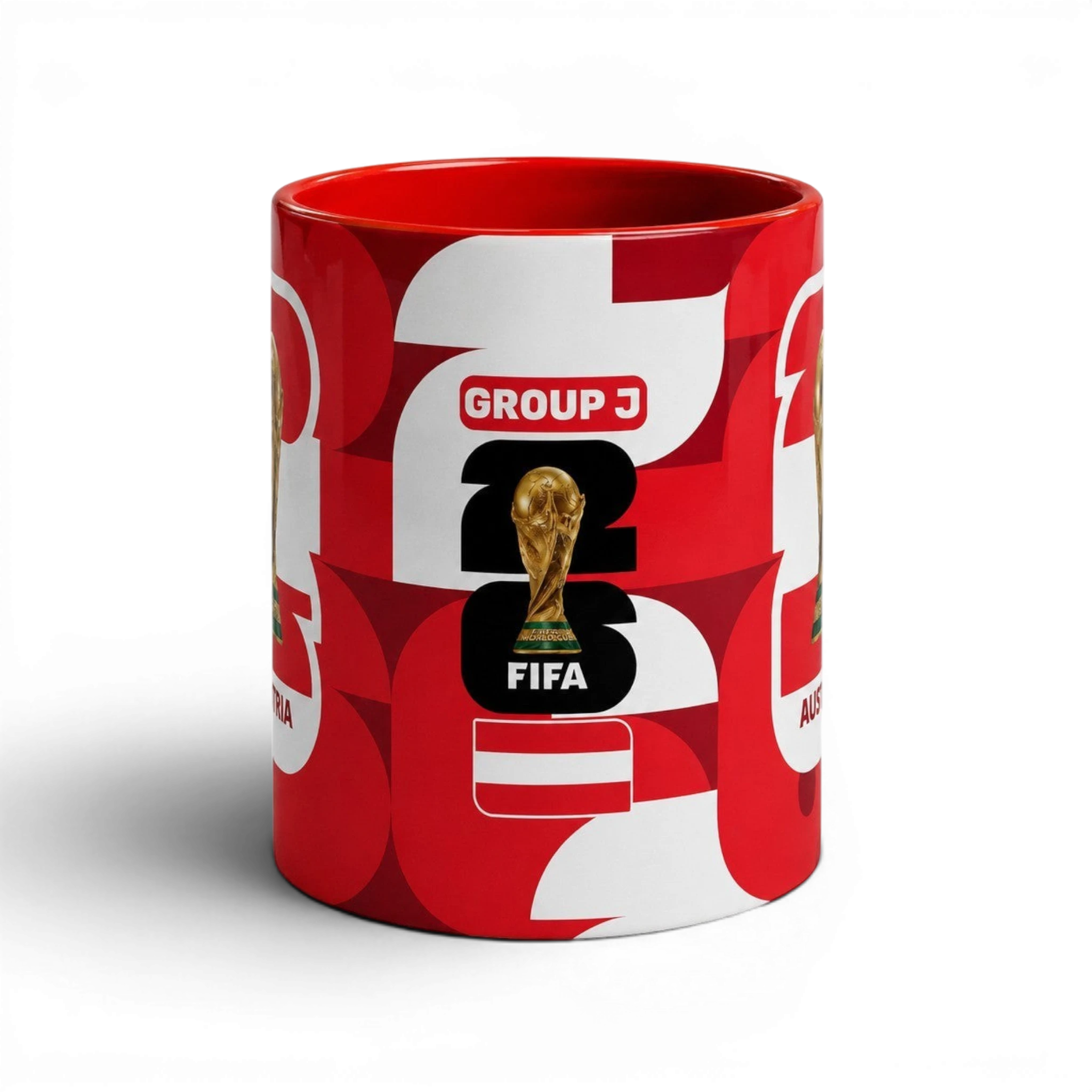 Fann Bliss Austria FIFA World Cup ceramic coffee mug in red and white with trophy graphic and Group J text.