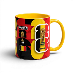 Fann Bliss Belgium World Cup ceramic coffee mug with red, black, and yellow football trophy graphic and Group G text.