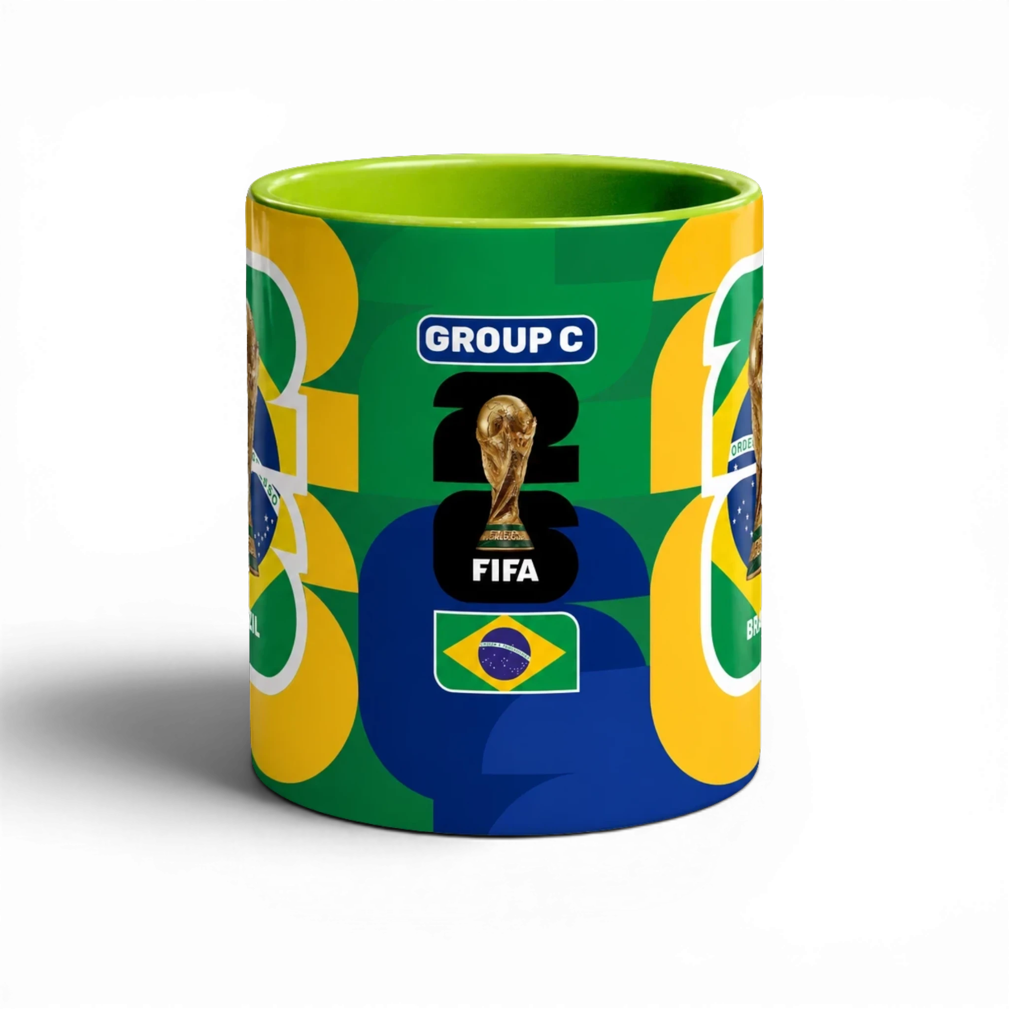 Fann Bliss ceramic mug celebrating the FIFA World Cup Brazil with trophy, flag, and "GROUP C" text. Green interior and handle.