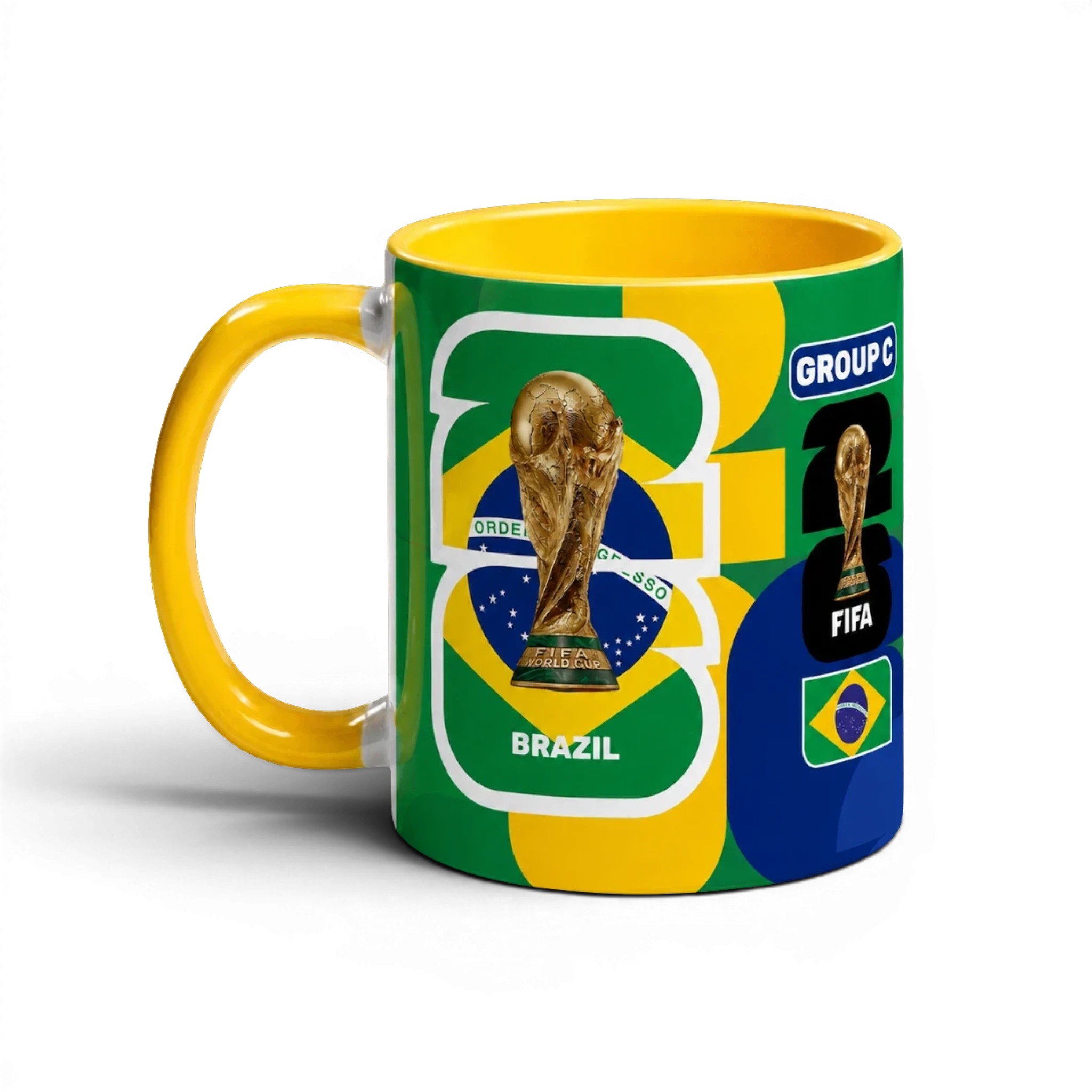 Fann Bliss FIFA World Cup Brazil commemorative ceramic coffee mug with trophy and flag design. Yellow handle.
