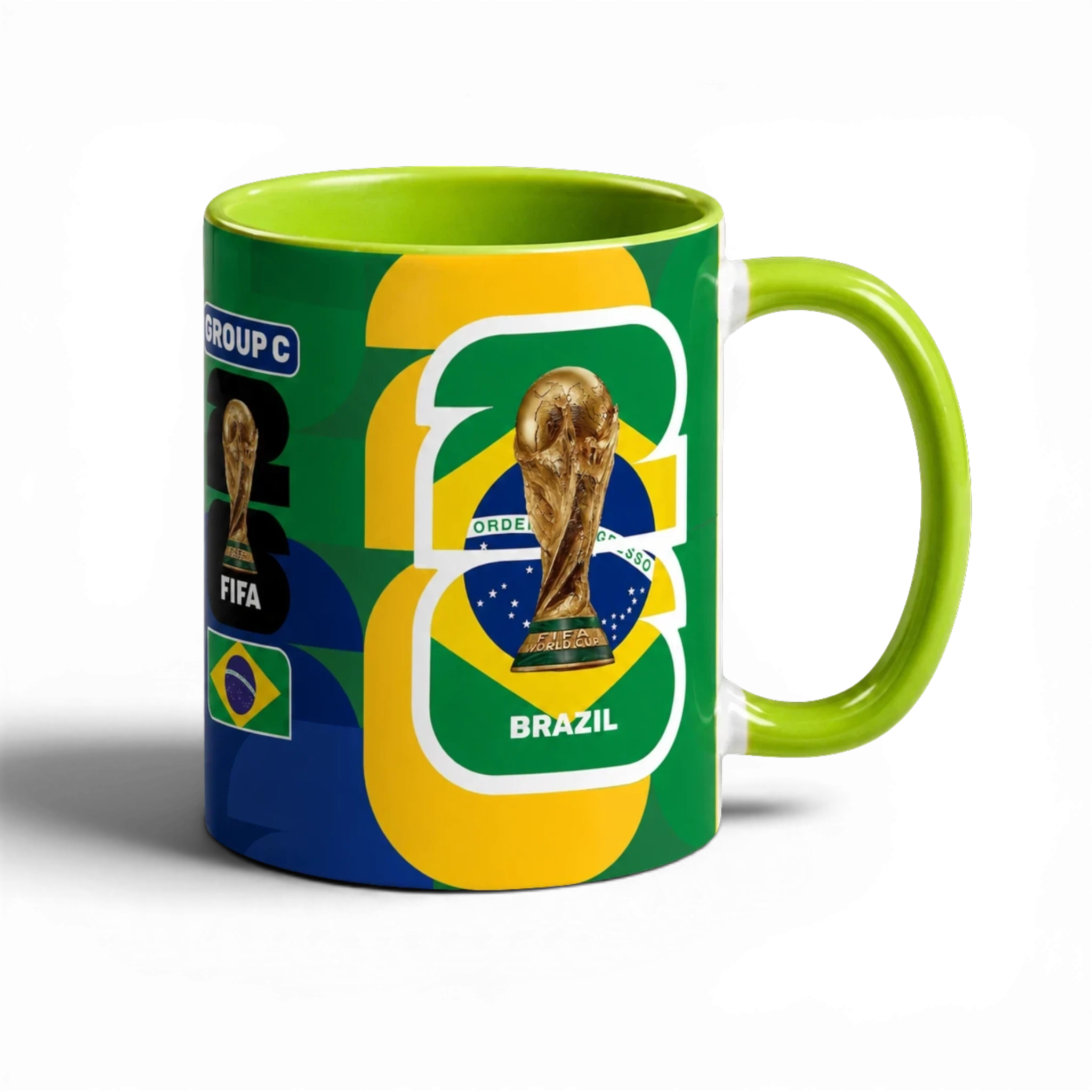 Fann Bliss Fifa World Cup Brazil commemorative ceramic mug with trophy and flag design. Green interior and handle.