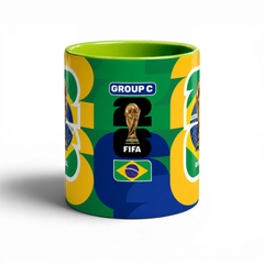 Fann Bliss ceramic mug celebrating the FIFA World Cup Brazil with trophy, flag, and "GROUP C" text. Green interior and handle.