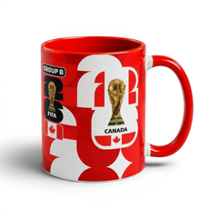 Fann Bliss Canada Soccer World Cup ceramic mug in red and white with FIFA trophy and Canadian flag graphics.