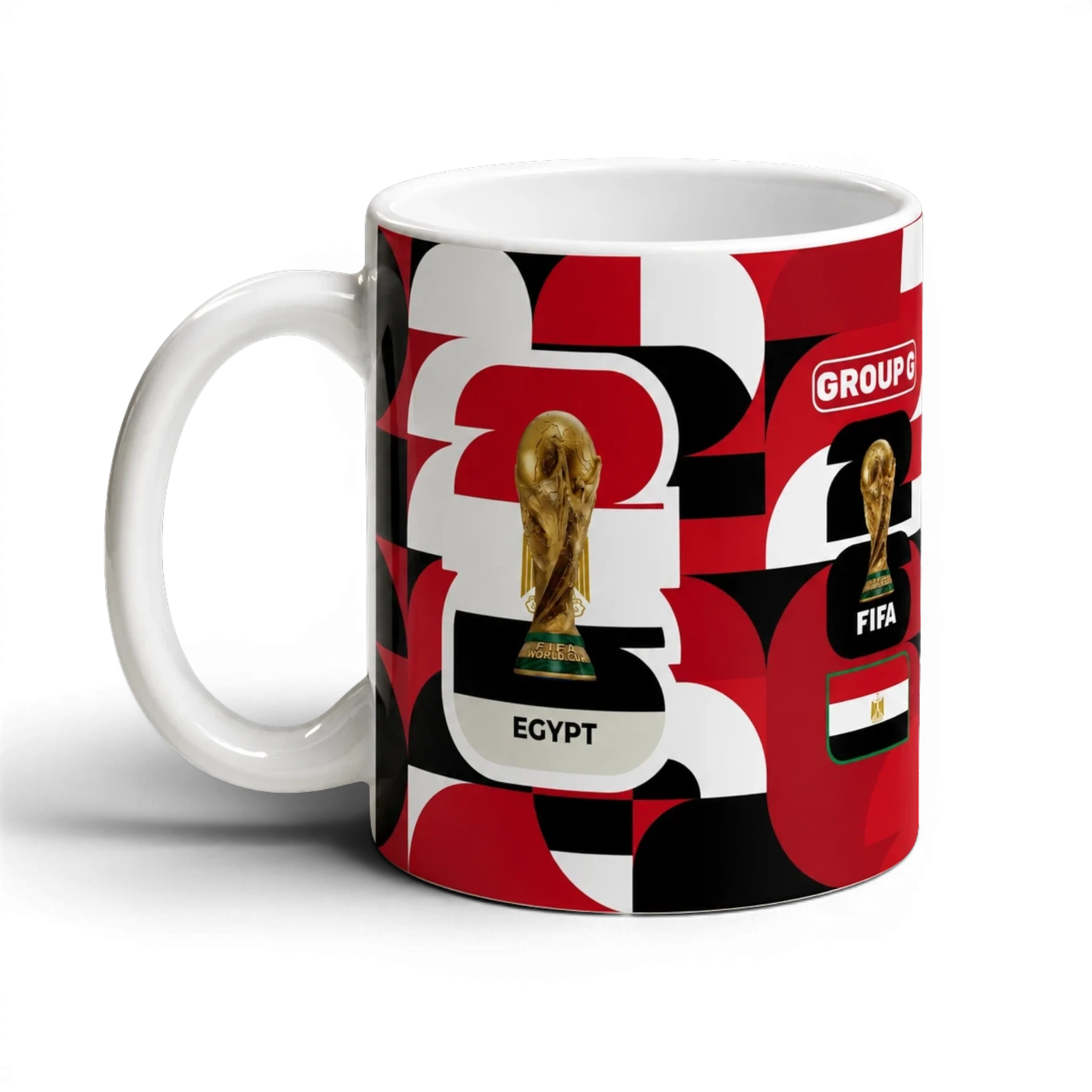 Fann Bliss Egypt World Cup Group G commemorative mug with FIFA trophy and flag graphics in red, black, and white.