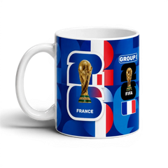 Fann Bliss France FIFA World Cup commemorative ceramic mug with trophy graphic and geometric pattern in blue, white, and red.