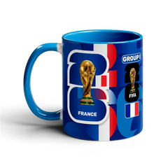 Fann Bliss France World Cup Trophy commemorative ceramic mug with blue handle and interior. Features FIFA trophy and French flag.