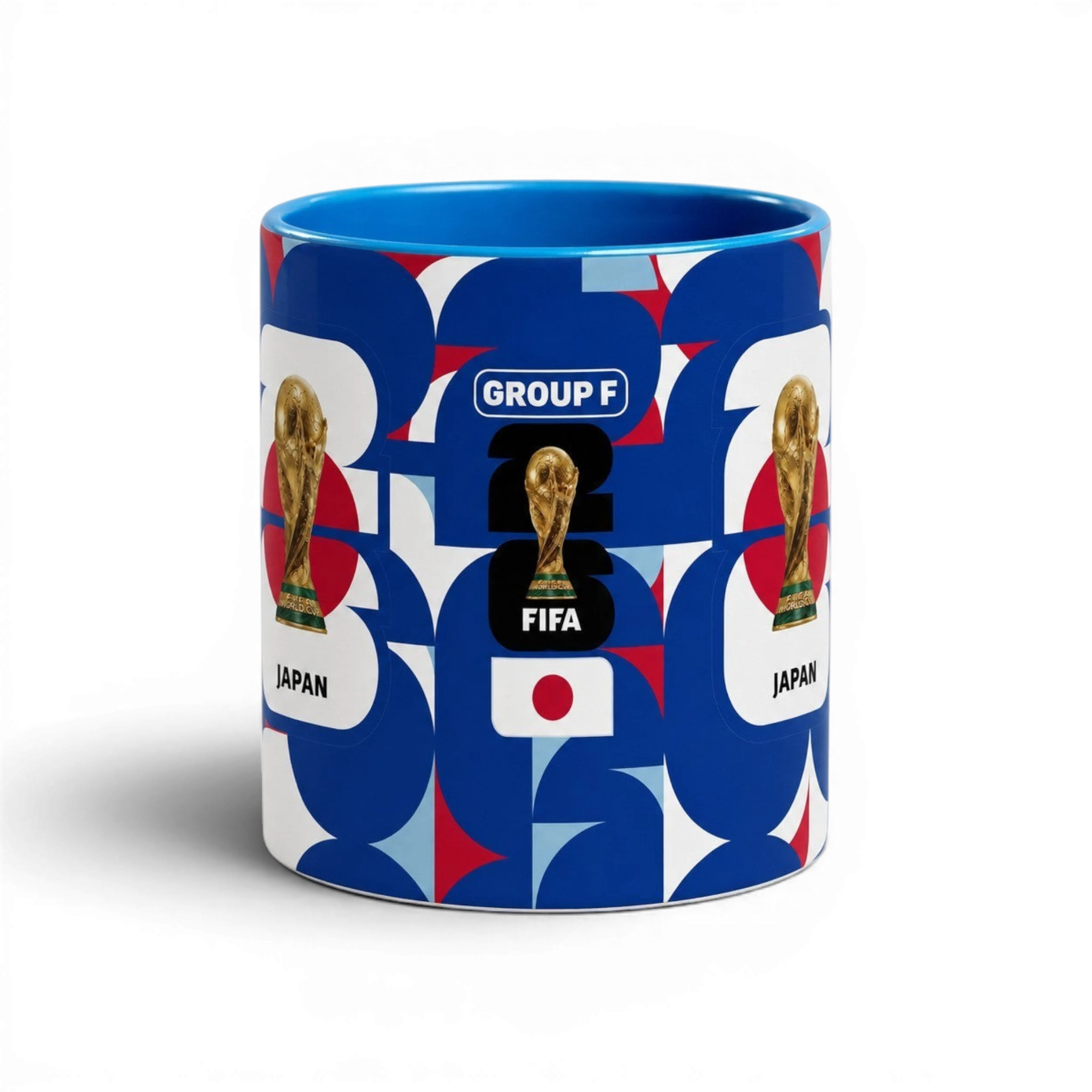 Fann Bliss ceramic coffee mug featuring Japan World Cup branding, FIFA trophy, and blue, white, and red geometric art.