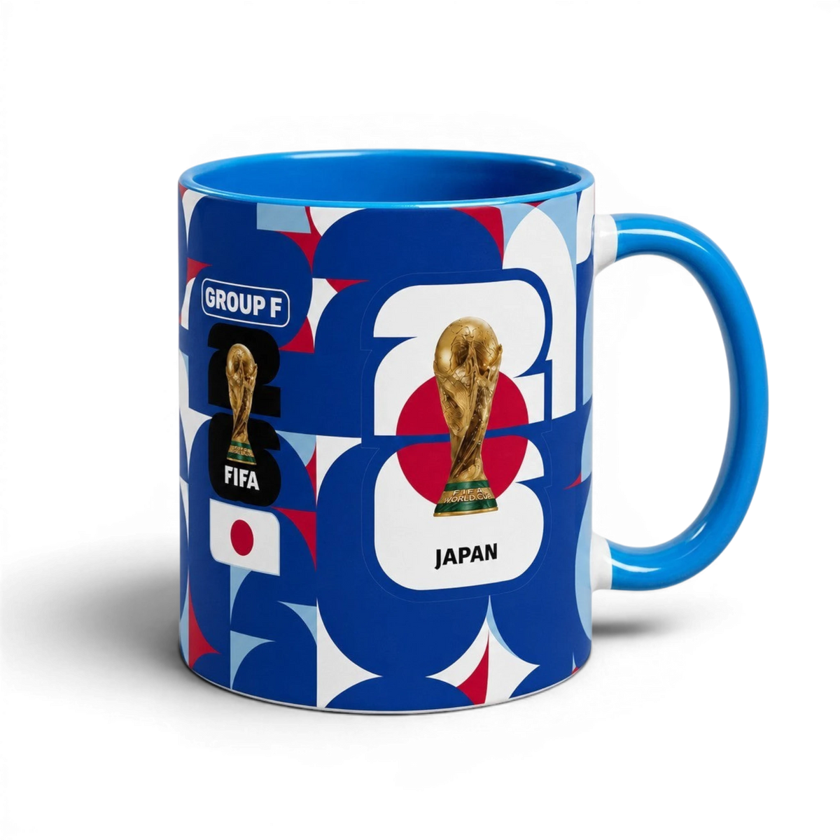 Fann Bliss ceramic coffee mug featuring Japan World Cup branding, FIFA trophy, and blue, white, and red geometric art.