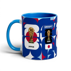Fann Bliss ceramic coffee mug featuring Japan World Cup trophy, geometric blue, red, and white pattern.