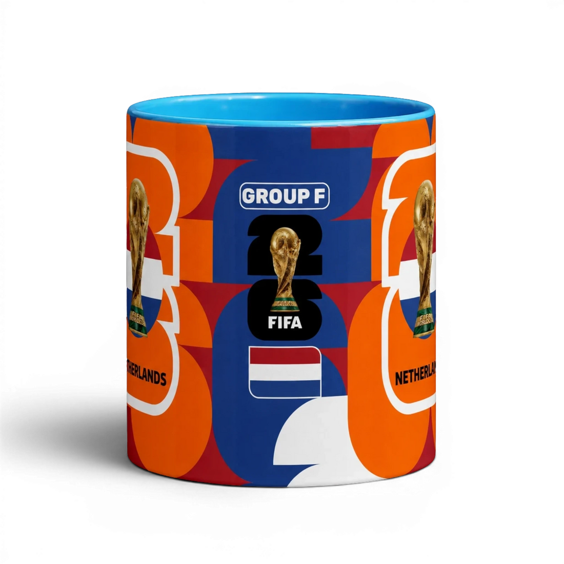 Fann Bliss Netherlands World Cup commemorative ceramic coffee mug with orange, blue, and white abstract pattern, FIFA trophy, and flag.
