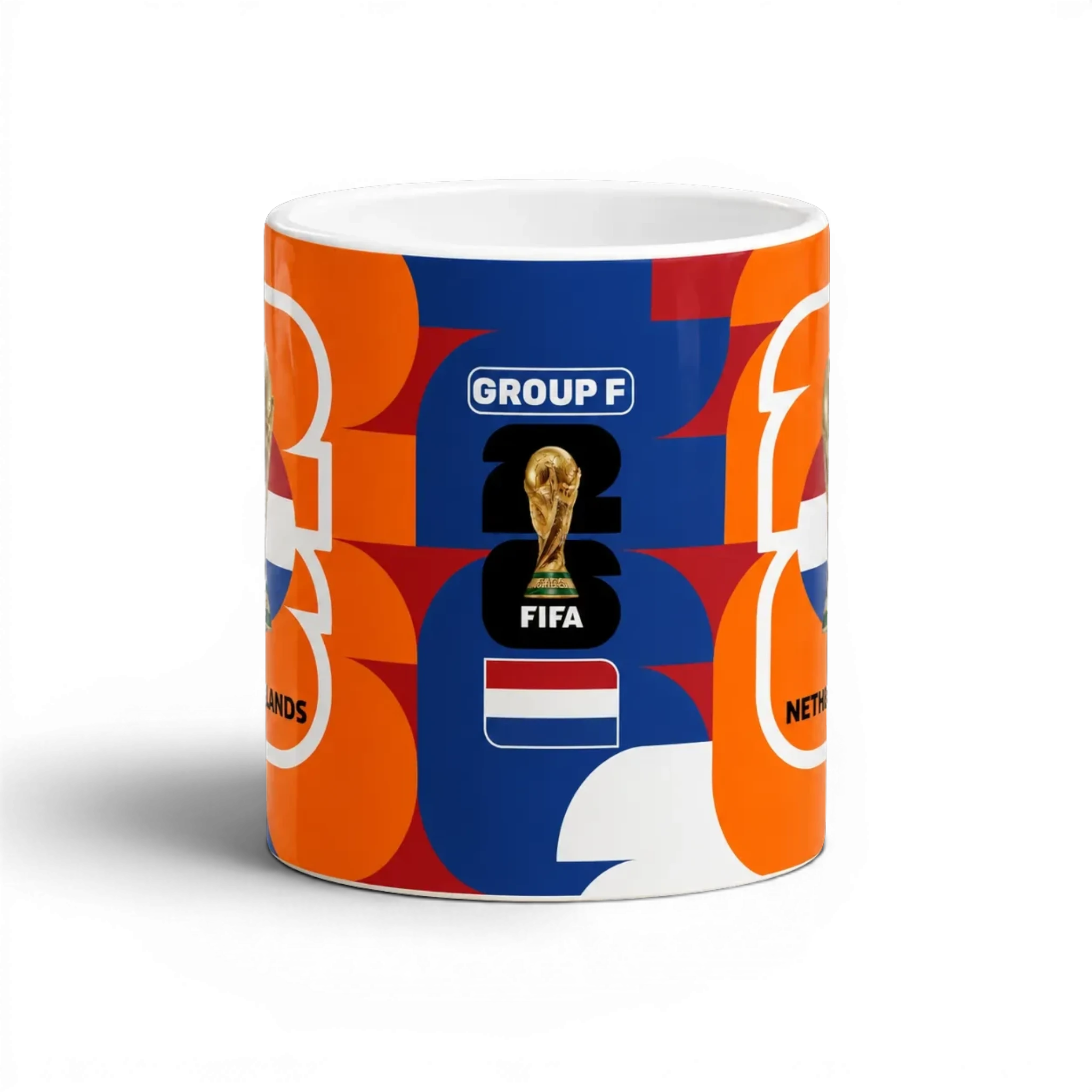 Fann Bliss Netherlands FIFA World Cup commemorative ceramic mug with orange, white, and blue geometric pattern.