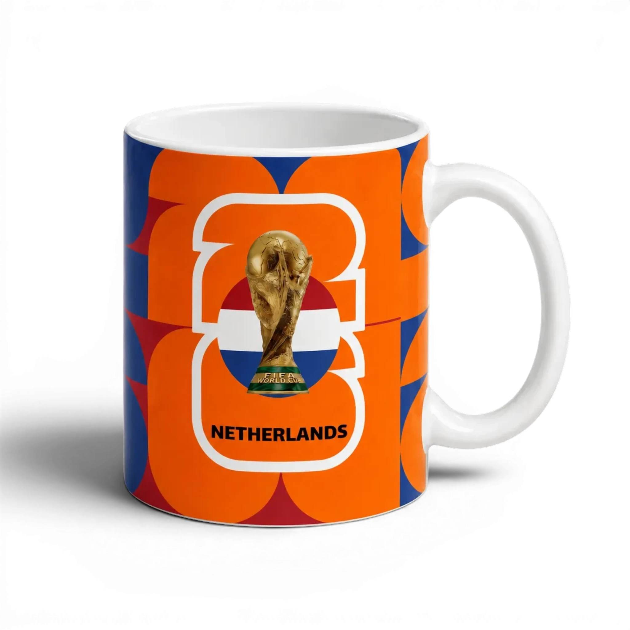 Fann Bliss Netherlands FIFA World Cup commemorative ceramic mug with orange, white, and blue geometric pattern.