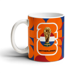 Fann Bliss Netherlands FIFA World Cup commemorative ceramic mug with orange, white, and blue geometric pattern.
