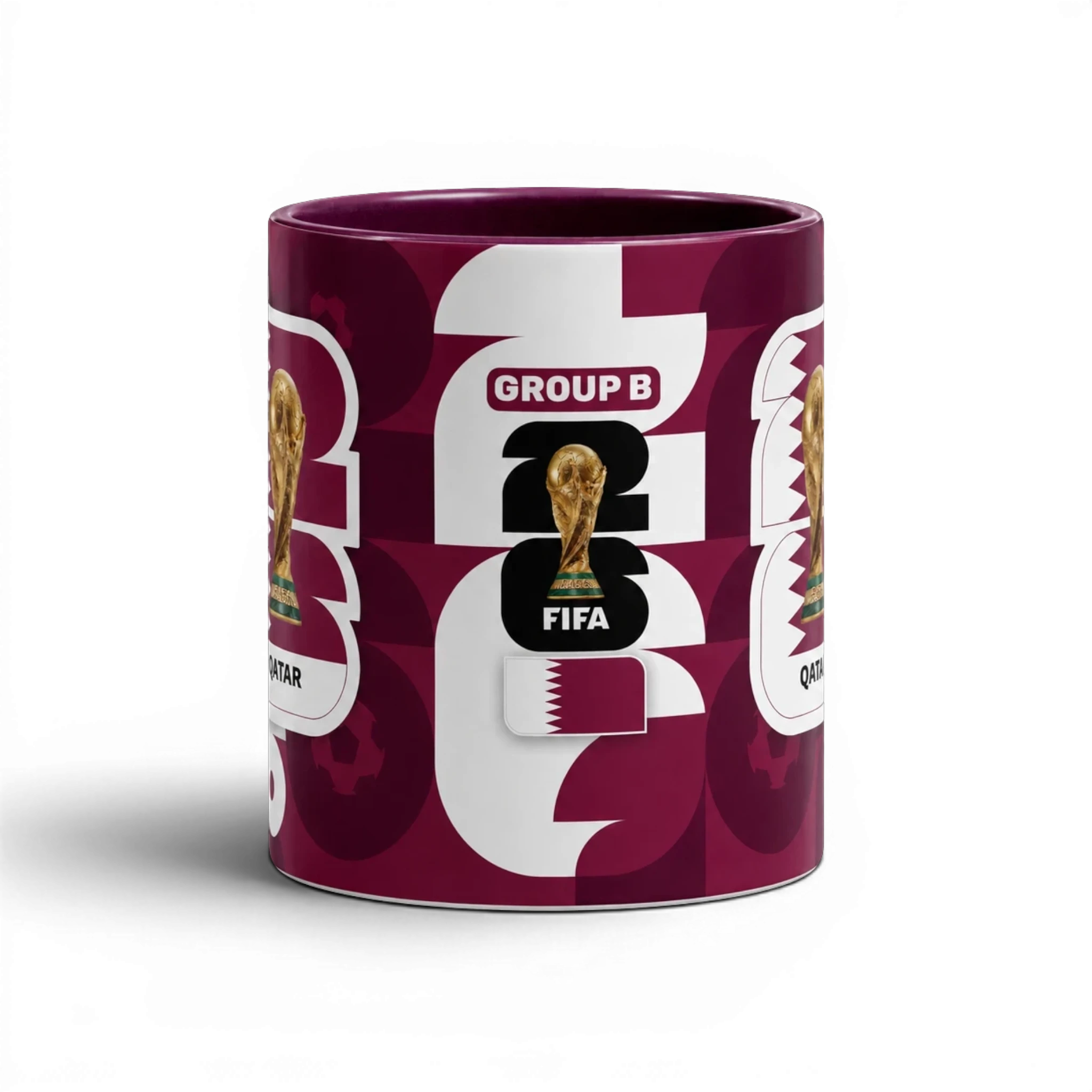 Fann Bliss FIFA World Cup Qatar 2022 commemorative mug with maroon and white geometric pattern, trophy, and Group B designation.