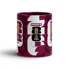 Fann Bliss FIFA World Cup Qatar 2022 commemorative mug with maroon and white geometric pattern, trophy, and Group B designation.