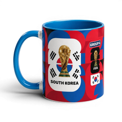 Fann Bliss South Korea World Cup ceramic mug with trophy graphic, blue interior, and red, blue, and black patterns.