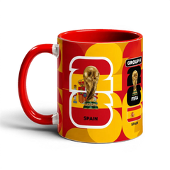Fann Bliss Spain FIFA World Cup commemorative mug in red and yellow, featuring the trophy and flag.