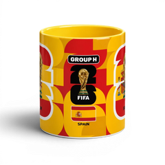 Fann Bliss Spain FIFA World Cup commemorative ceramic mug in red and yellow with trophy and flag design.