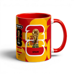 Fann Bliss Spain FIFA World Cup commemorative mug in red and yellow with trophy and flag design. Ceramic.